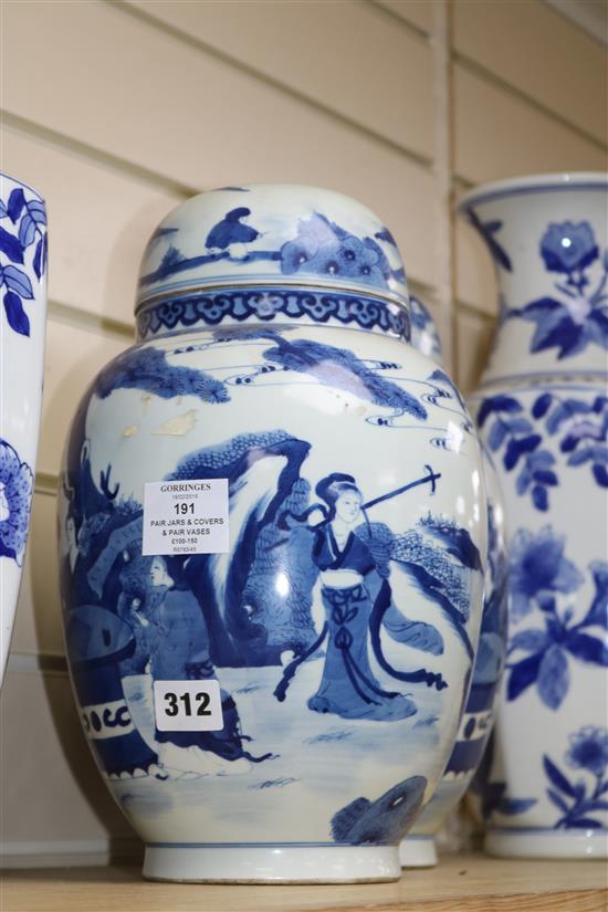 A pair of Chinese blue and white jars and cover and a pair of blue and white vases